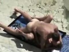 Voyeuring mom with her holiday lover at beach