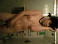 Small titted teen masturbates in shower