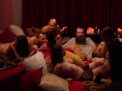 Couples strip down as they meet and greet in the living room
